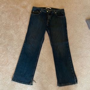 Mens jeans cut at the bottom on both legs